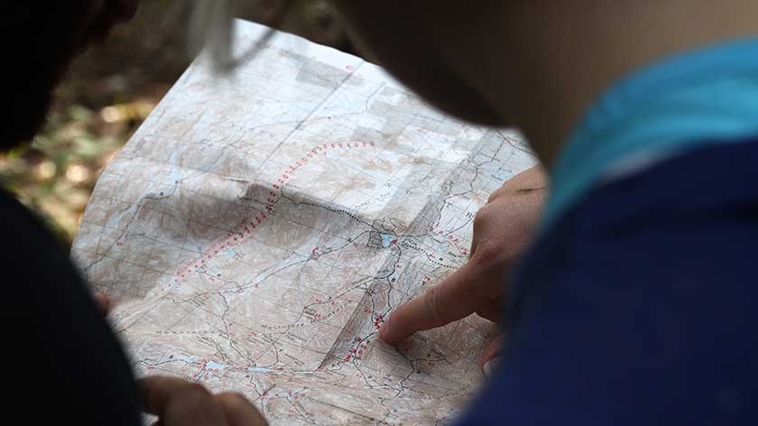 People looking at travel map