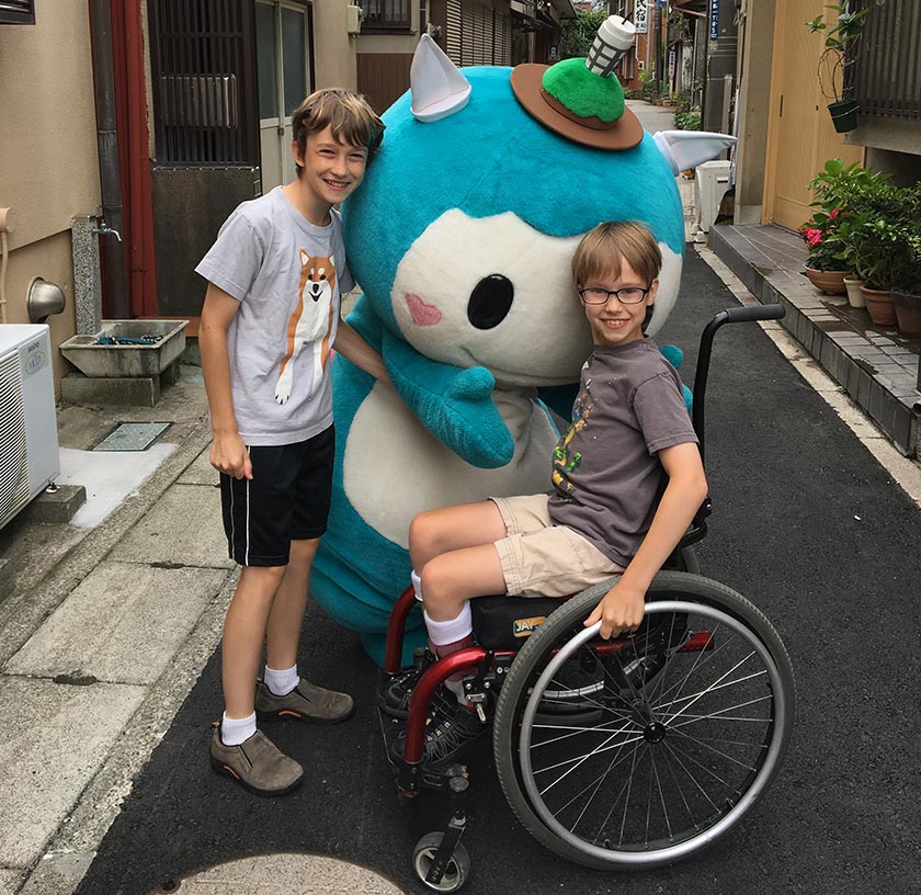 Dominick and Xander with a mascot character