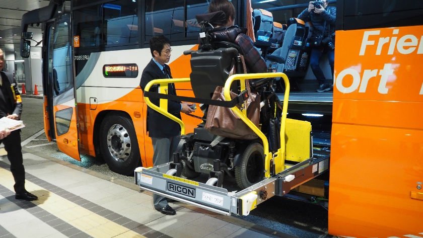 Accessible airport bus wheelchair user on lift