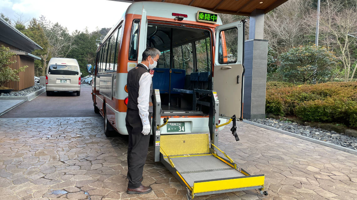 Bus servicing the onsen area with a wheelchair lift in the back